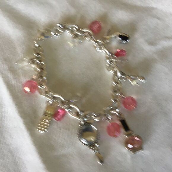 $12 ea of 3/$25. Silvertone “Girly” Charm Bracelet - Picture 5 of 7